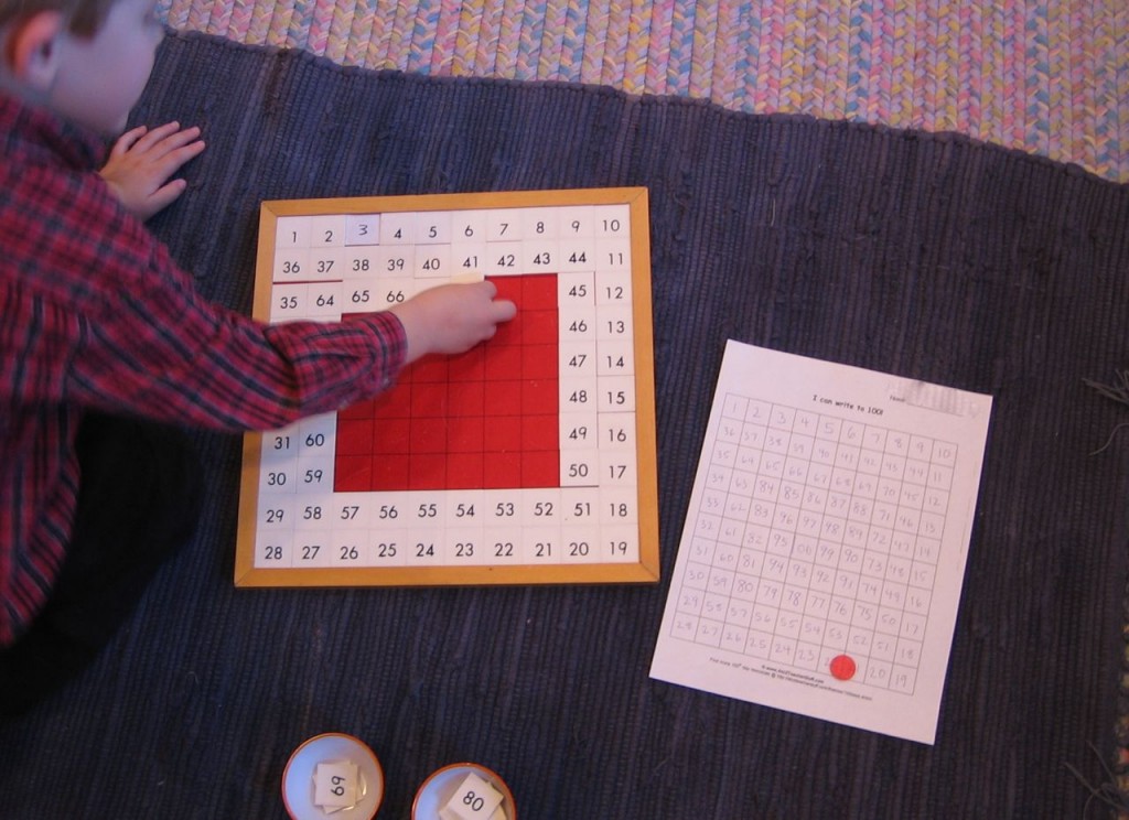 a child completing the Hundred Board math activity